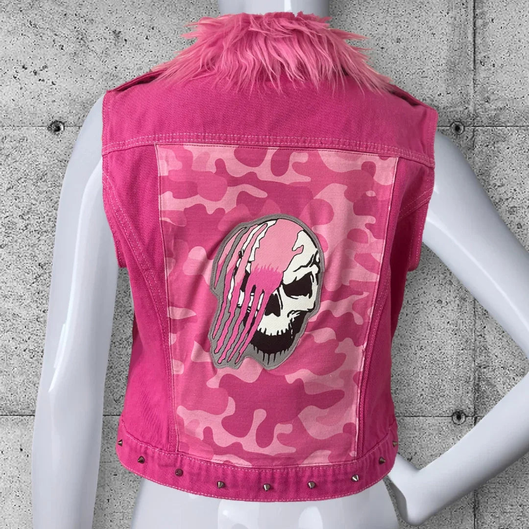 Women's pink punk rocker vest with faux fur collar, camo back panel, and skull patch design