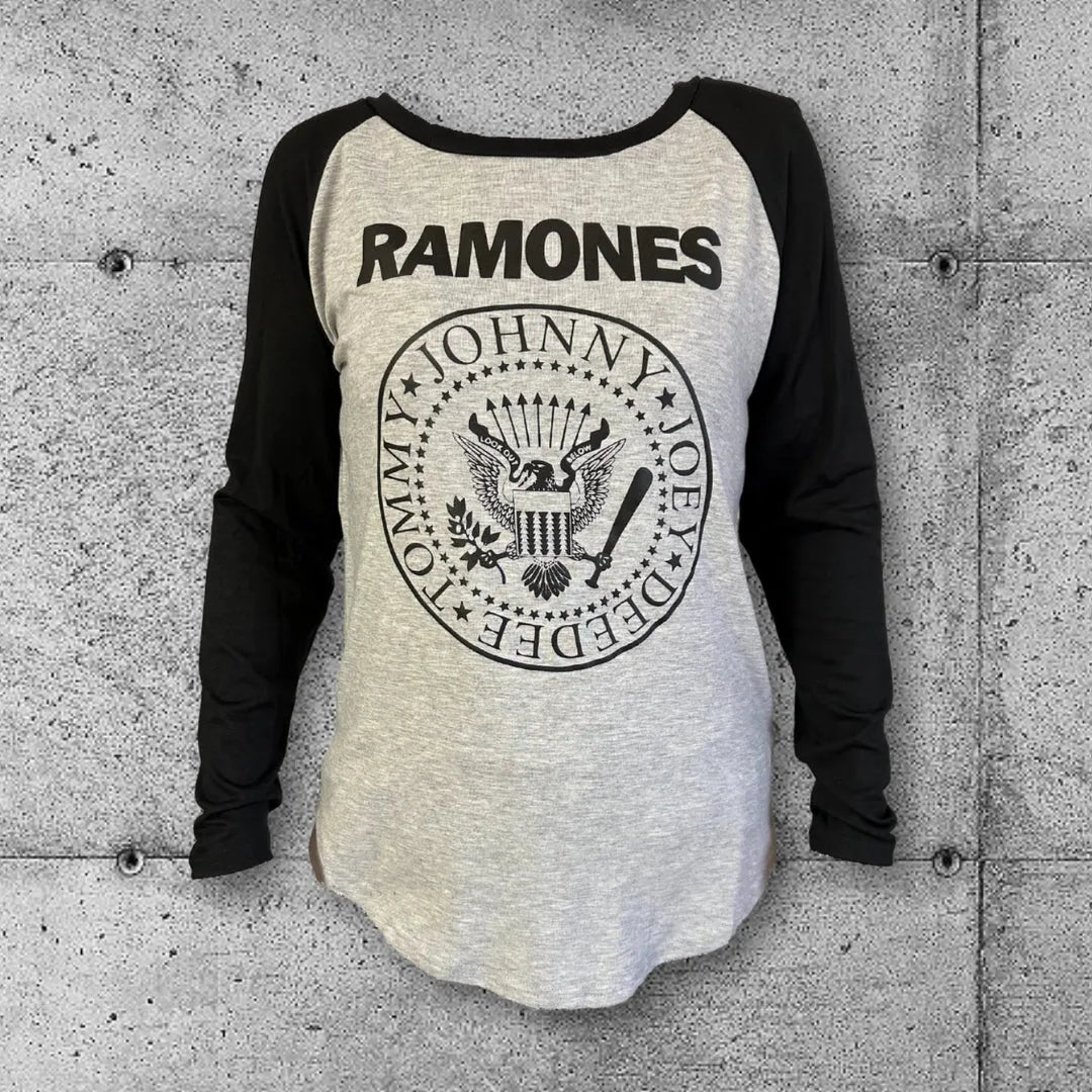 Women's Ramones raglan punk tee with black sleeves and band logo on concrete background