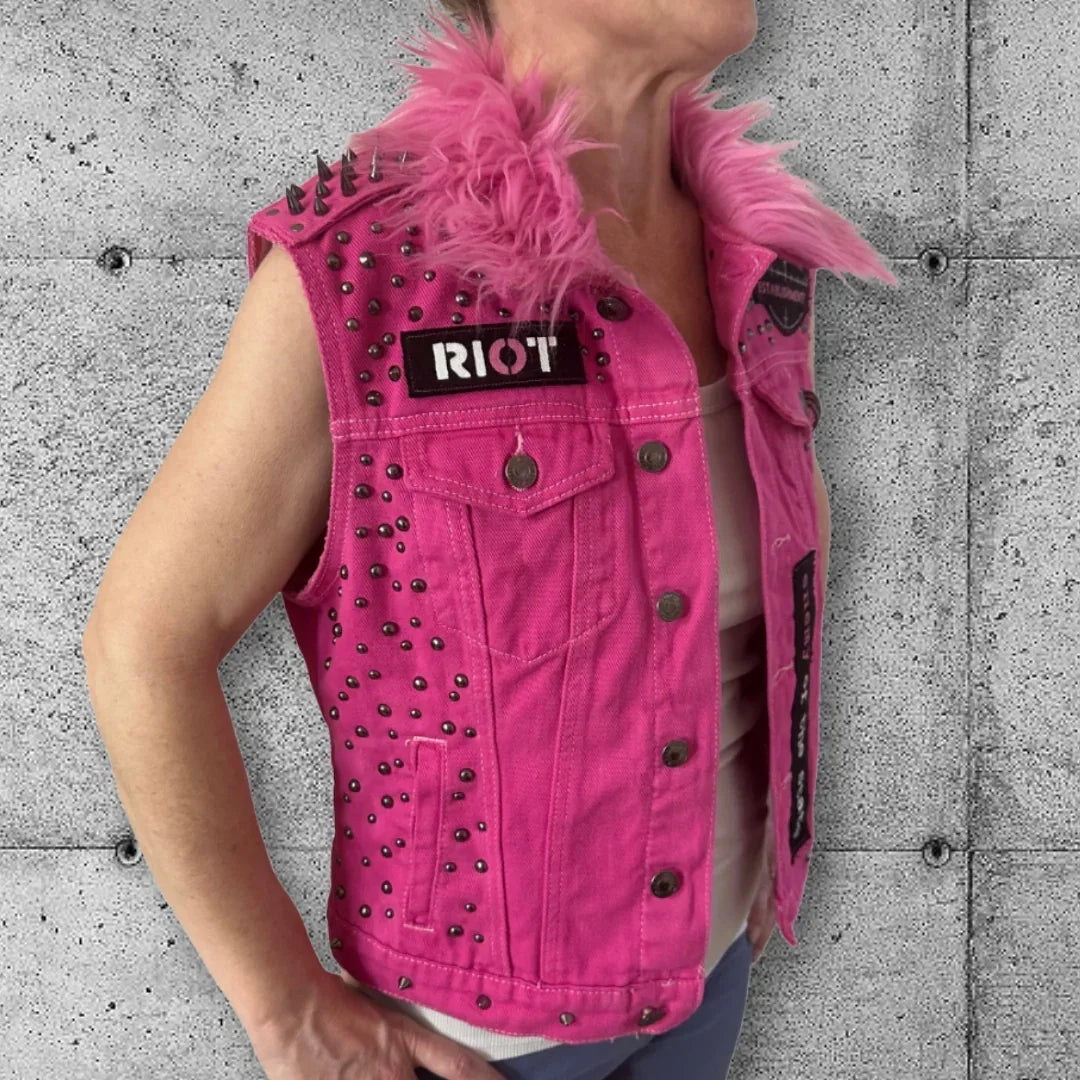 Pink studded punk vest with RIOT patch and fuzzy collar, edgy rocker style for women