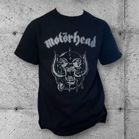 Black Motörhead band logo t-shirt with gothic punk graphic against a concrete wall