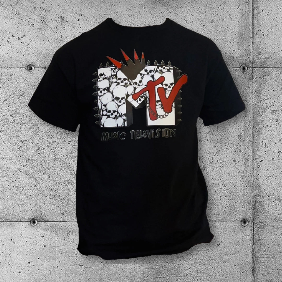 Black punk MTV t-shirt with skulls and spikes, rocker gothic style on concrete background