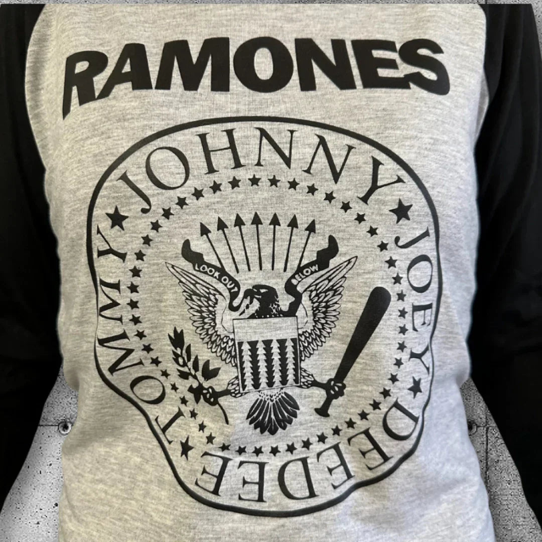 Women's Ramones raglan tee with black sleeves, punk band logo on gray front.