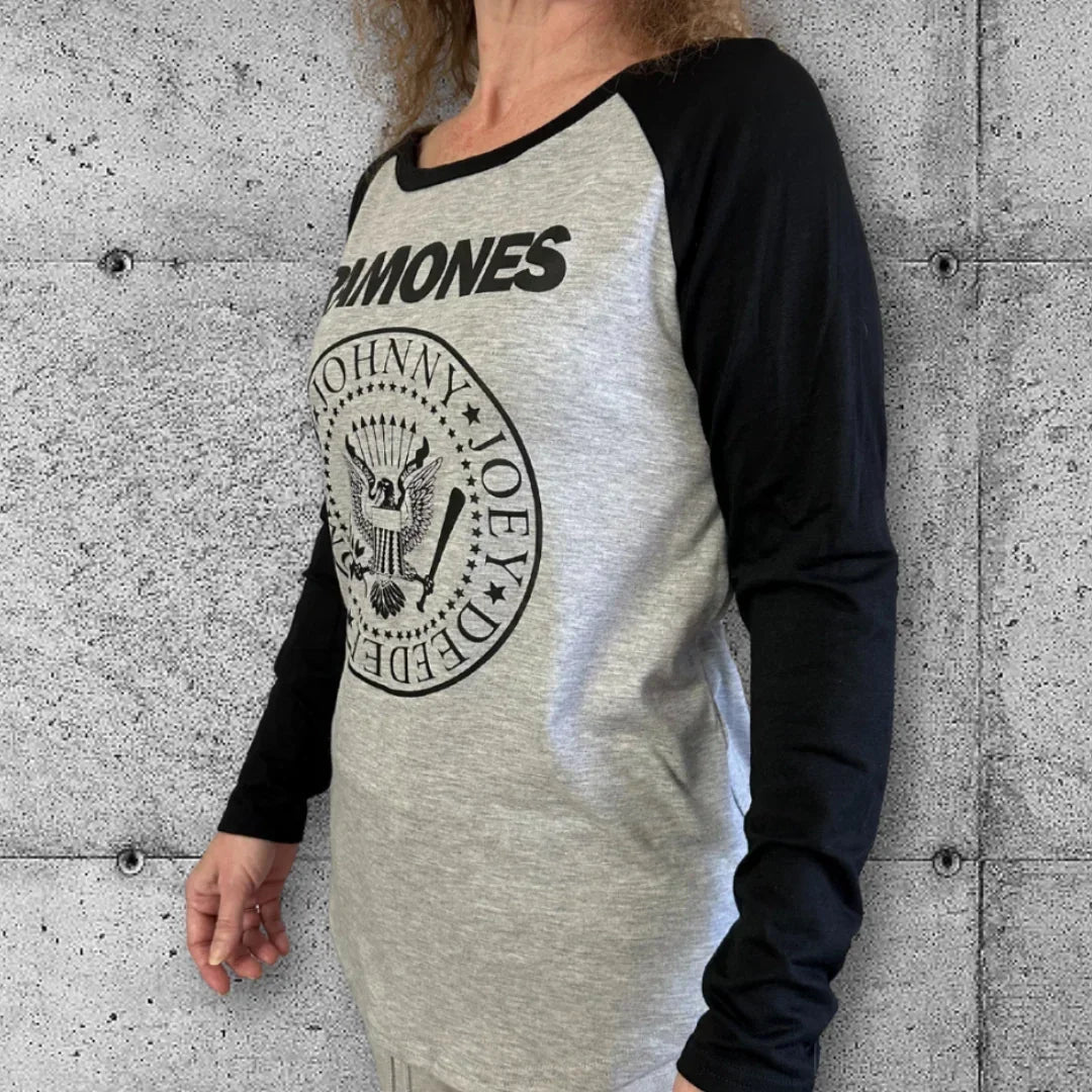 Woman wearing gray and black Ramones raglan punk rocker tee with band logo.