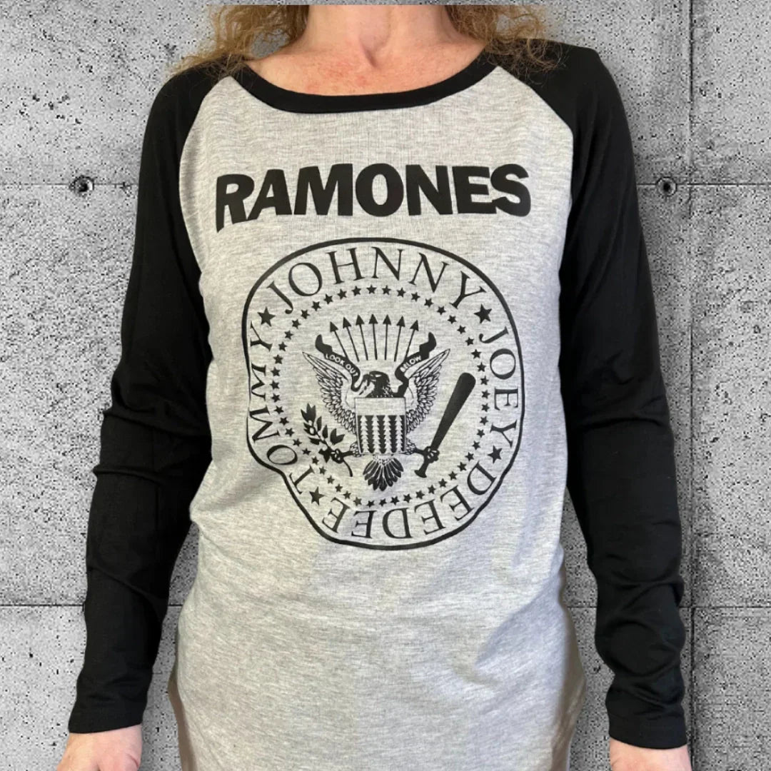 Woman wearing grey and black Ramones raglan punk band tee with iconic logo graphic