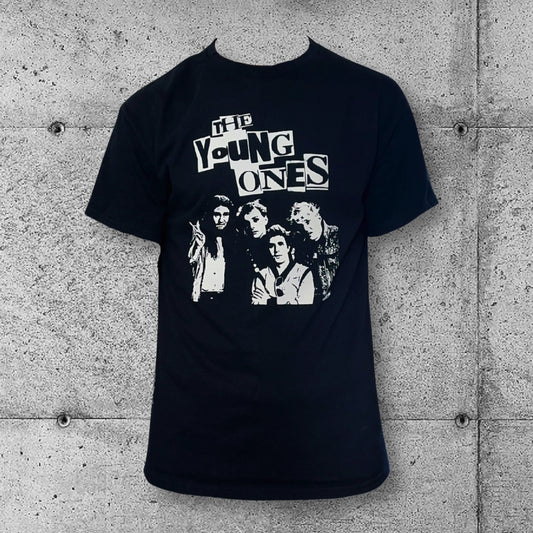 The Young Ones punk band T-shirt in black with white graphic and text, concrete wall background